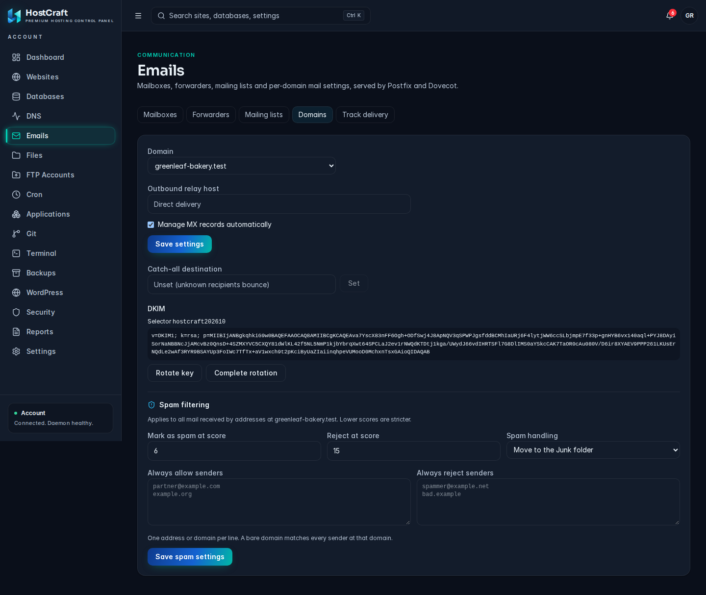 Domains tab with outbound relay host, MX management, catch-all, DKIM key rotation and spam filtering settings